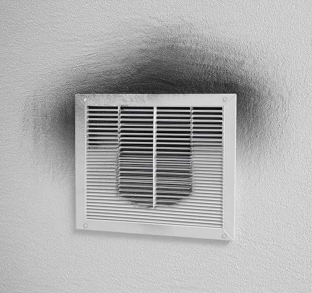 Air vent with soot buildup